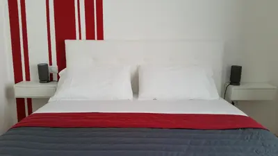 Letto o letti in una camera di La Libra Rooms