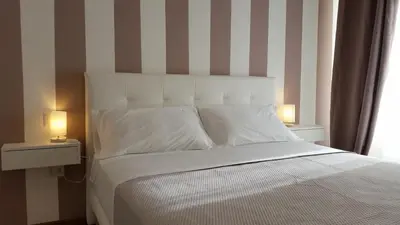Letto o letti in una camera di La Libra Rooms