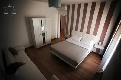 Letto o letti in una camera di La Libra Rooms