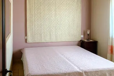 Letto o letti in una camera di Case Vacanza Bithia