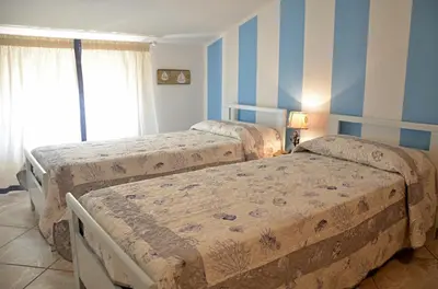 Letto o letti in una camera di Anemone Guest House