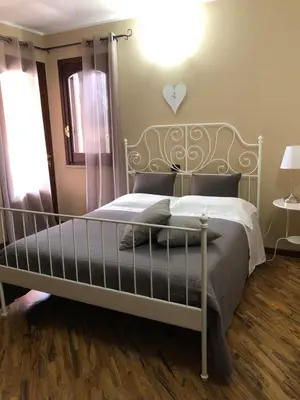 Letto o letti in una camera di B&B Martina