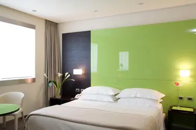 Letto o letti in una camera di UNA HOTELS T Hotel Cagliari