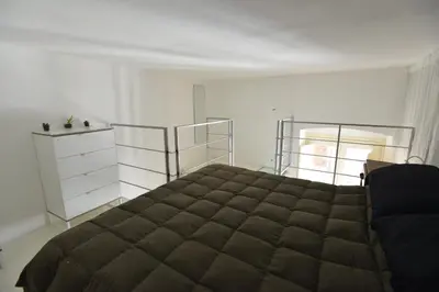 Letto o letti in una camera di IzzHome Light