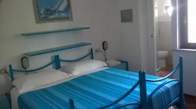 Letto o letti in una camera di B&B Vacanza Facile