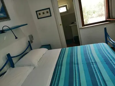 Letto o letti in una camera di B&B Vacanza Facile