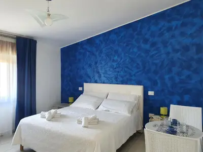 Letto o letti in una camera di Blue Velvet Rooms