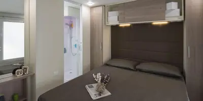 Letto o letti in una camera di Camping villaggio L'Ultima spiaggia