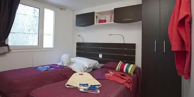 Letto o letti in una camera di Camping villaggio L'Ultima spiaggia