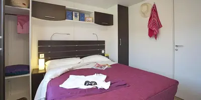 Letto o letti in una camera di Camping villaggio L'Ultima spiaggia
