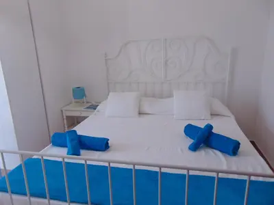 Letto o letti in una camera di Appartamenti in Villa Nicanda