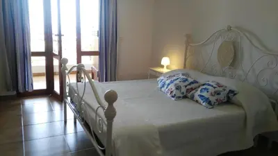 Letto o letti in una camera di Appartamenti in Villa Nicanda
