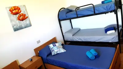 Letto o letti in una camera di Su Sattisceddu