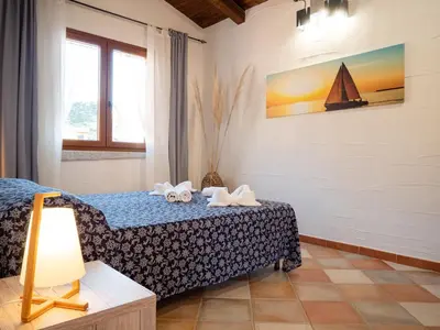 Letto o letti in una camera di Il Veliero Tanca Piras
