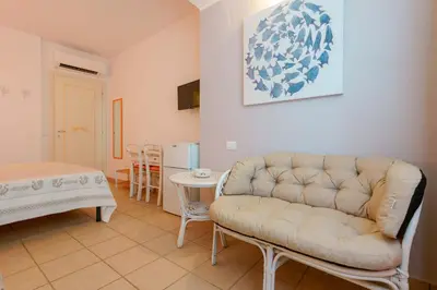 Letto o letti in una camera di Il Piccolo Giardino rooms & breakfast