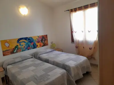 Letto o letti in una camera di Nuova Valmar Ginepri 