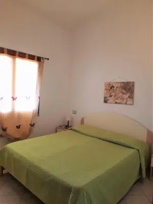 Letto o letti in una camera di Nuova Valmar Ginepri 