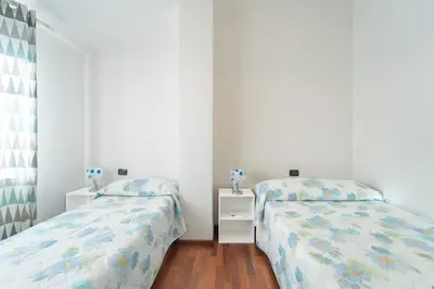 Letto o letti in una camera di Margherita Holiday House