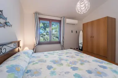 Letto o letti in una camera di Margherita Holiday House