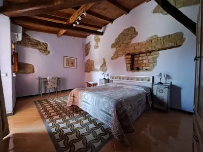 Letto o letti in una camera di Sa Domu de sa Contissa
