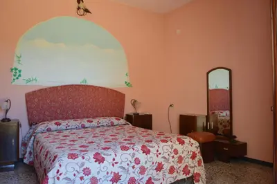 Letto o letti in una camera di Sa Domu de sa Contissa