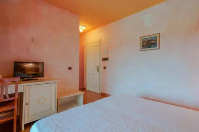 Letto o letti in una camera di Hotel I Ginepri