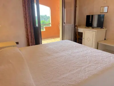 Letto o letti in una camera di Hotel I Ginepri