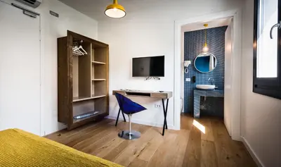 TV o dispositivi per l'intrattenimento presso Teku Sardinia Boutique Hotel