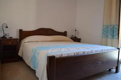 Letto o letti in una camera di Casa Vacanze La Pavoncella