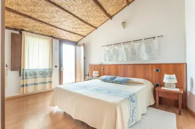 Letto o letti in una camera di Hotel Villa Canu