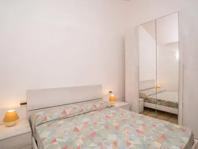 Letto o letti in una camera di Holiday Home Residence Delphino - REI250 by Interhome