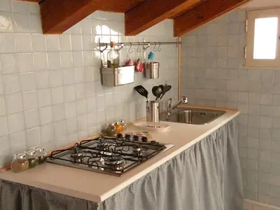 Cucina o angolo cottura di Deliziosa mansarda nel quartiere Marina - Cagliari Q8577