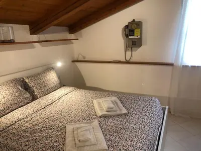 Letto o letti in una camera di Deliziosa mansarda nel quartiere Marina - Cagliari Q8577