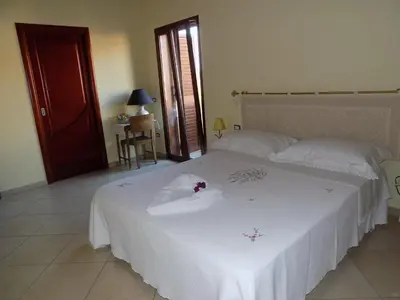 Letto o letti in una camera di Al Ciclamino