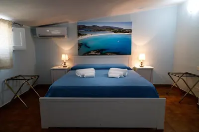 Letto o letti in una camera di Casa Tacconi
