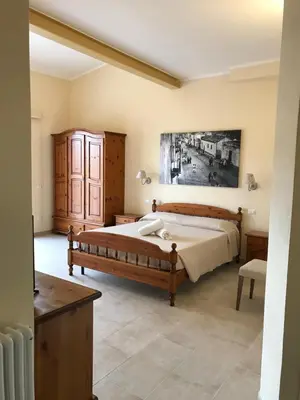 Letto o letti in una camera di Casa Tacconi