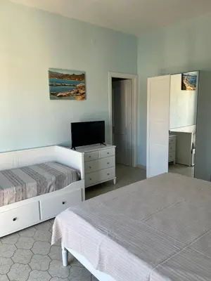 Letto o letti in una camera di Casa Tacconi