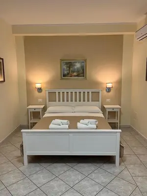 Letto o letti in una camera di Casa Tacconi