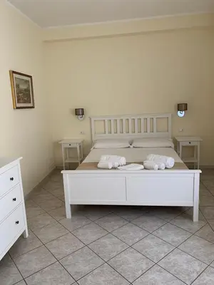 Letto o letti in una camera di Casa Tacconi