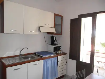 Cucina o angolo cottura di Casa Vacanze Cala Sapone
