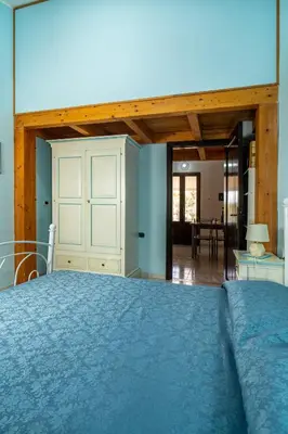Letto o letti in una camera di Casa Vacanze Cala Sapone