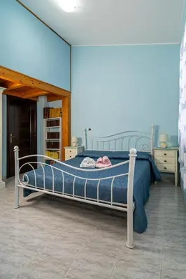 Letto o letti in una camera di Casa Vacanze Cala Sapone