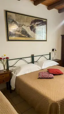 Letto o letti in una camera di Cagliari Novecento