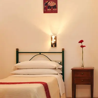 Letto o letti in una camera di Cagliari Novecento