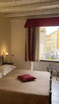 Letto o letti in una camera di Cagliari Novecento
