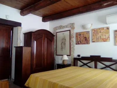 Letto o letti in una camera di Villa Adriana - Torre delle Stelle - mini appartamenti - Cagliari Villasimus Sardegna