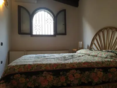 Letto o letti in una camera di Villa Adriana - Torre delle Stelle - mini appartamenti - Cagliari Villasimus Sardegna