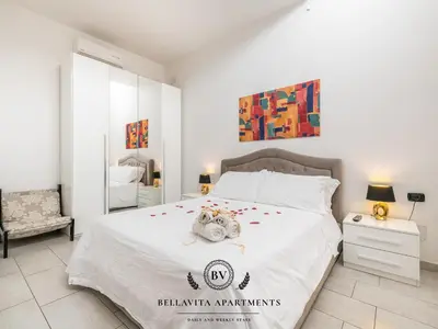 Letto o letti in una camera di BellaVita Apartments