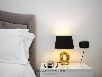 Letto o letti in una camera di BellaVita Apartments