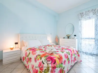 Letto o letti in una camera di BellaVita Apartments